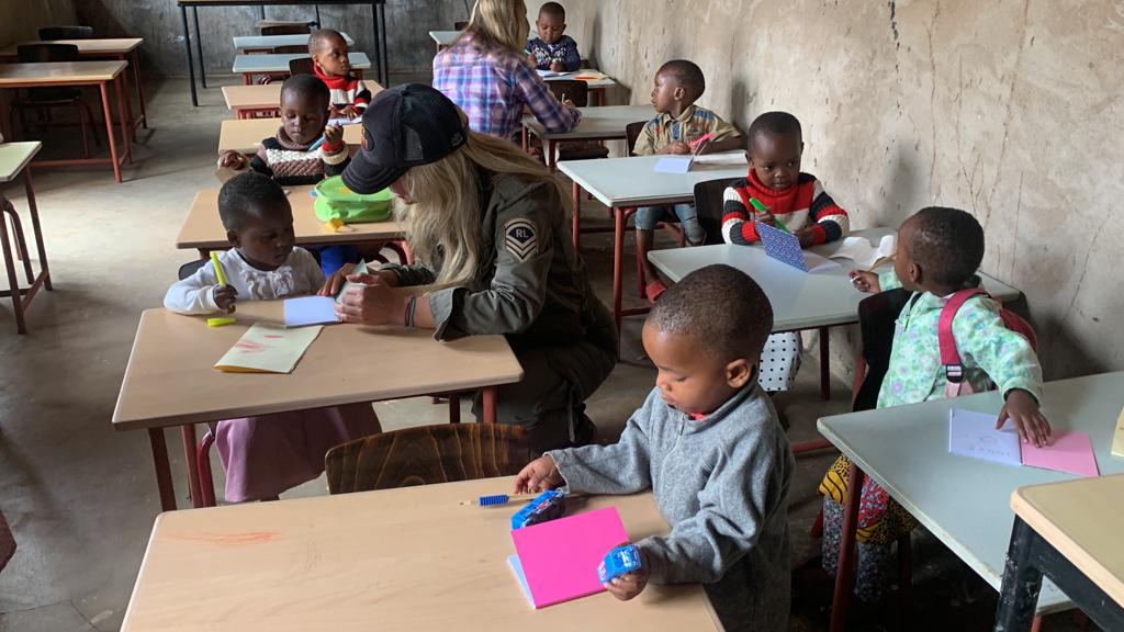 Children learning with proper desks and materials in rural Tanzania